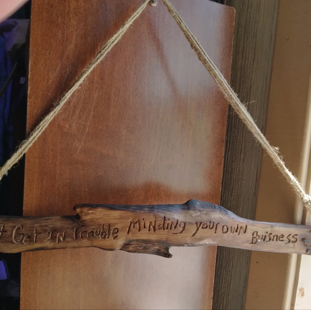 "Can't get in trouble minding your own business" wall hanging sign